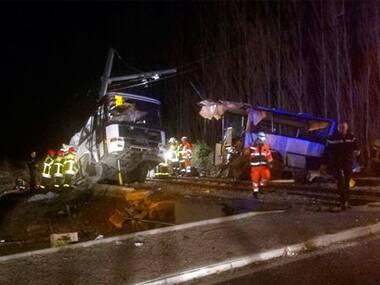Train ploughs into school bus in Millas, France, severs it into two pieces; four children killed, 20 injured