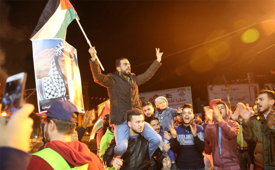 Palestinian protestors chanted slogans as they waived their national flags and pictures of Arafat during a protest at the main square in Gaza City on Wednesday. Trump upended decades of US policy in defiance of warnings from around the world that the gesture risks aggravating conflict in the tinderbox West Asia. Palestinian protestors chanted slogans as they waived their national flags and pictures of Arafat during a protest at the main square in Gaza City on Wednesday. Trump upended decades of US policy in defiance of warnings from around the world that the gesture risks aggravating conflict in the tinderbox West Asia.