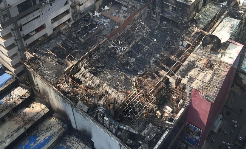 A view of the charred building in which a fire broke out in Mumbai on early Friday. At least 14 people were killed and as many injured after a major fire in Kamala Mills Compound in Lower Parel. PTI 