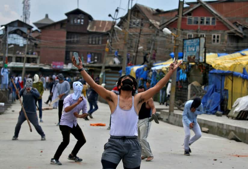 Stone pelters clash with police during disturbances in Kashmir in May 2017. Reuters