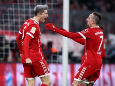 Bayern Munich's Robert Lewandowski celebrates scoring their first goal with Franck Ribery. Reuters