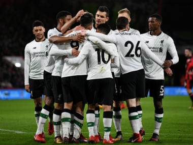 Liverpool's Roberto Firmino celebrates with team mates after scoring their fourth goal. Reuters