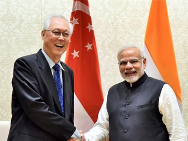 Former Prime Minister of Singapore, Goh Chok Tong shakes hands with Prime Minister, Narendra Modi during a meeting in New Delhi on Wednesday. PTI