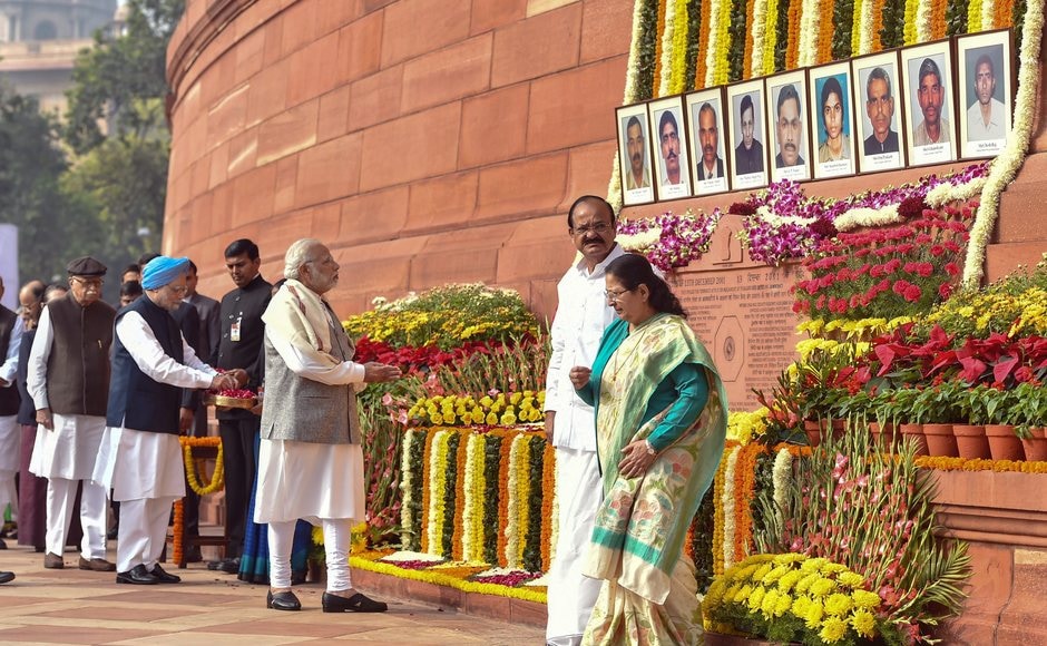 Days after bitter political slugfest ahead of the last phase of Gujarat polls, Prime Minister Narendra Modi and his predecessor Manmohan Singh on Wednesday greeted each other at an event to pay homage to the people who died in the 2001 Parliament attack. PTI Days after bitter political slugfest ahead of the last phase of Gujarat polls, Prime Minister Narendra Modi and his predecessor Manmohan Singh on Wednesday greeted each other at an event to pay homage to the people who died in the 2001 Parliament attack. PTI
