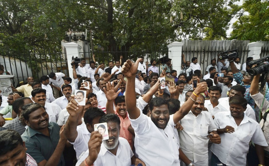 Supporters of Dhinakaran celebrate after he established a decisive lead during the counting of votes for RK Nagar bypoll, outside the counting centre in Chennai on Sunday. PTI Supporters of Dhinakaran celebrate after he established a decisive lead during the counting of votes for RK Nagar bypoll, outside the counting centre in Chennai on Sunday. PTI