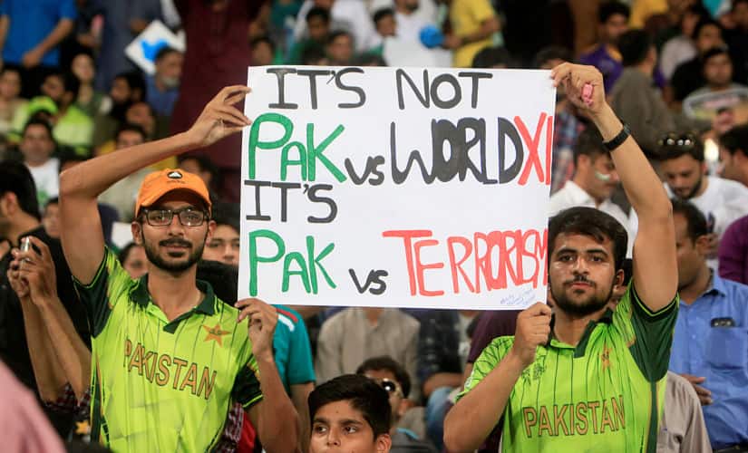 Spectators hold a sign during Pakistan’s final match of World XI series in Lahore. Reuters