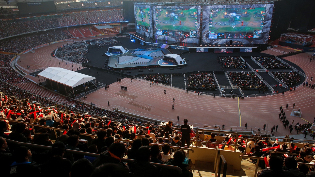 People watch the League of Legends 2017 World Championships Grand Final esports match between Samsung Galaxy and SK Telecom T1 at the Beijing National Stadium in Beijing, China, November 4, 2017. Picture taken November 4, 2017. REUTERS/Thomas Peter TPX IMAGES OF THE DAY - RC1CAEE1C340