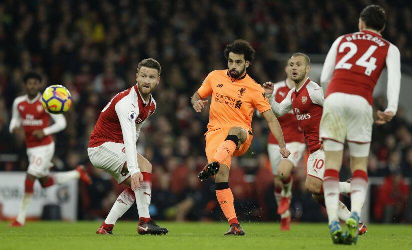 Liverpool’s Mohamed Salah shoots and scores his side’s second goal during their match against Arsenal. AP 