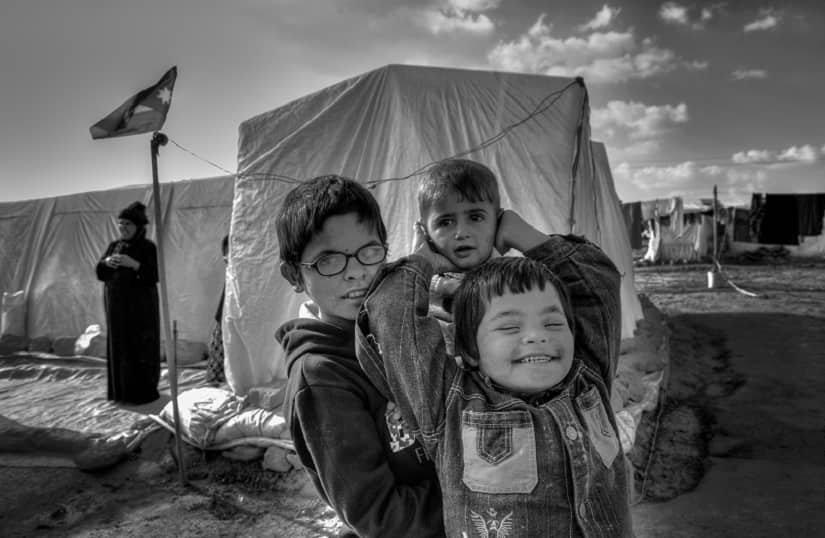 Children at the refugee camp in Jordan. Photo courtesy: Filippo Sbalchiero/Peacebuilding Project in Jordan/IAHV