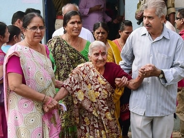 Senior citizen coming out after casting their vote during the first phase of Gujarat state assembly election in Rajkot on Saturday. PTI