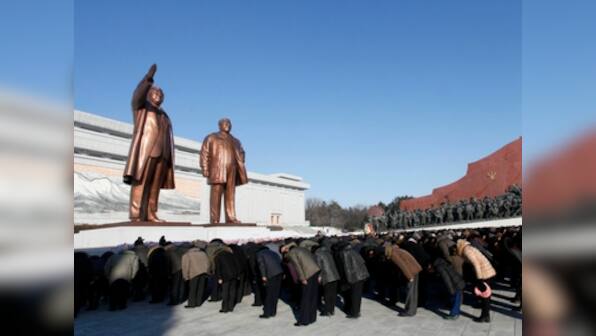 North Koreans pay tribute to Kim Jong II on his sixth death anniversary, march towards Mansu hill monument