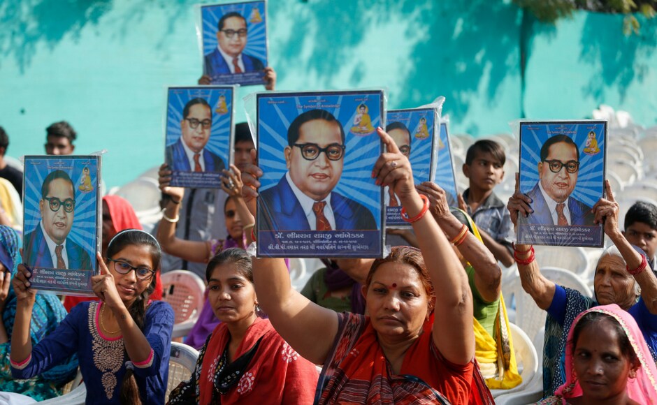 During India's main Opposition Congress party vice-president Rahul Gandhi's visit to the Dalit Shakti Kendra, a vocational training institute run by Dalit activists in Gujarat, women held Amberkar's pictures to show their respect for the leader. AP During India's main Opposition Congress party vice-president Rahul Gandhi's visit to the Dalit Shakti Kendra, a vocational training institute run by Dalit activists in Gujarat, women held Amberkar's pictures to show their respect for the leader. AP