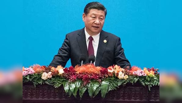 Xi Jinping pledges to continue economic reforms in China, says the country will defend authority of UN