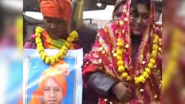 Woman who married Yogi Adityanath's picture charged with sedition for stopping UP CM's convoy