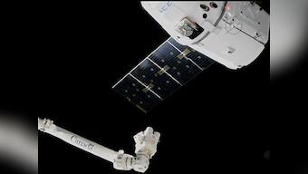 SpaceX Dragon docks into the ISS carrying a promise of better fiber optics, space beer and self assembling materials