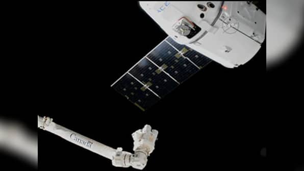 SpaceX Dragon docks into the ISS carrying a promise of better fiber optics, space beer and self assembling materials