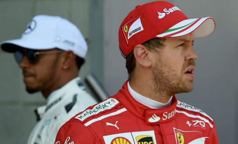 File image of Lewis Hamilton (left) and Sebastian Vettel. AFP