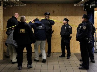 FBI members enter the crime scene beneath the New York Port Authority Bus Terminal following an attempted detonation on Monday. Reuters