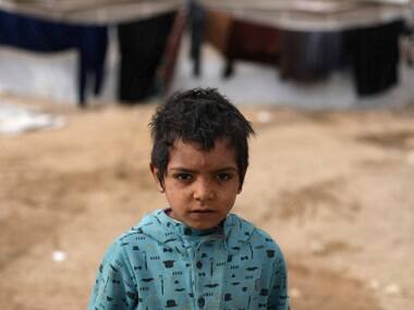 Syrian refugee camps in Jordan draw Asian tourists looking for selfies, adoptions