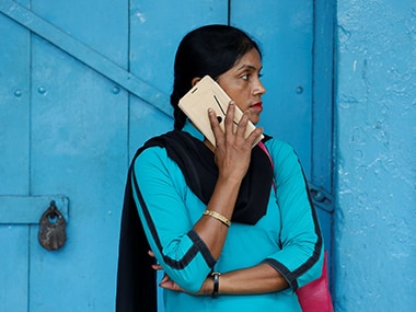 A woman speaks on her smartphone. Image: Reuters