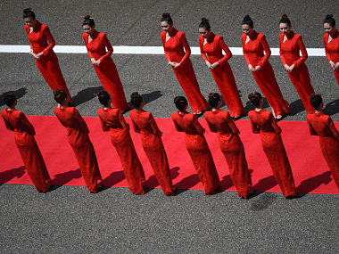 Formula One ends practice of using 'grid girls' before races to keep up with modern day societal norms Formula One ends practice of using 'grid girls' before races to keep up with modern day societal norms