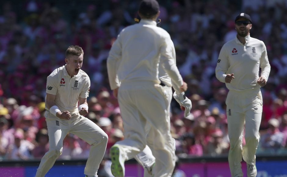 England's Mason Crane, left, finally had reason to celebrate as he got his first Test wicket by dismissing Usman Khawaja. AP England's Mason Crane, left, finally had reason to celebrate as he got his first Test wicket by dismissing Usman Khawaja. AP