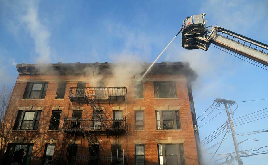 The six-alarm fire broke out at about 5:30 am local time in a four-story brick structure with a furniture store on the ground floor, Kenneth Reilly told Reuters. AP The six-alarm fire broke out at about 5:30 am local time in a four-story brick structure with a furniture store on the ground floor, Kenneth Reilly told Reuters. AP