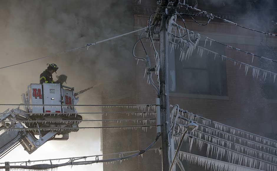 More than 200 firefighters were still battling the blaze in frigid temperatures of around 15 degrees Fahrenheit (-9.4 Celsius) two hours after it started, said Reilly, adding that the cause was yet to be determined. AP More than 200 firefighters were still battling the blaze in frigid temperatures of around 15 degrees Fahrenheit (-9.4 Celsius) two hours after it started, said Reilly, adding that the cause was yet to be determined. AP