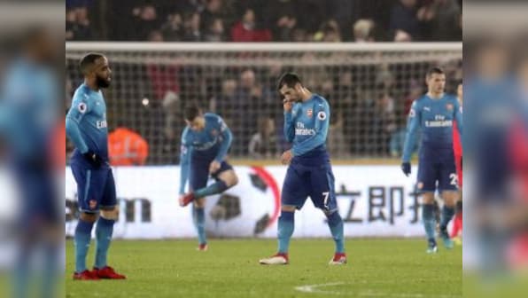 Premier League: Arsenal crash to shock defeat at Swansea; Liverpool swat aside Huddersfield