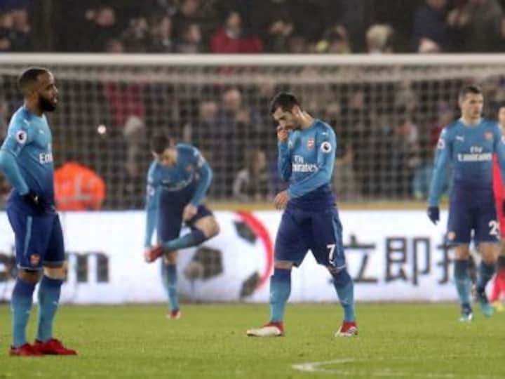 Premier League: Arsenal crash to shock defeat at Swansea; Liverpool swat aside Huddersfield