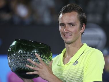 Daniil Medvedev holds the trophy after his win over Alex De Minaur. AP