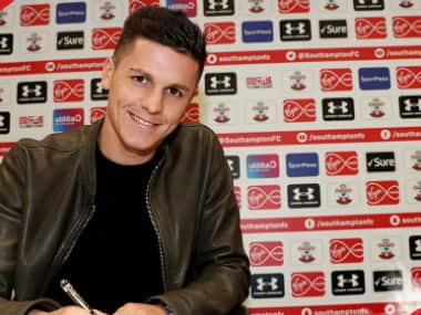 Carrillo poses after signing for Premier League side Southampton. Twitter: @SaintsFC