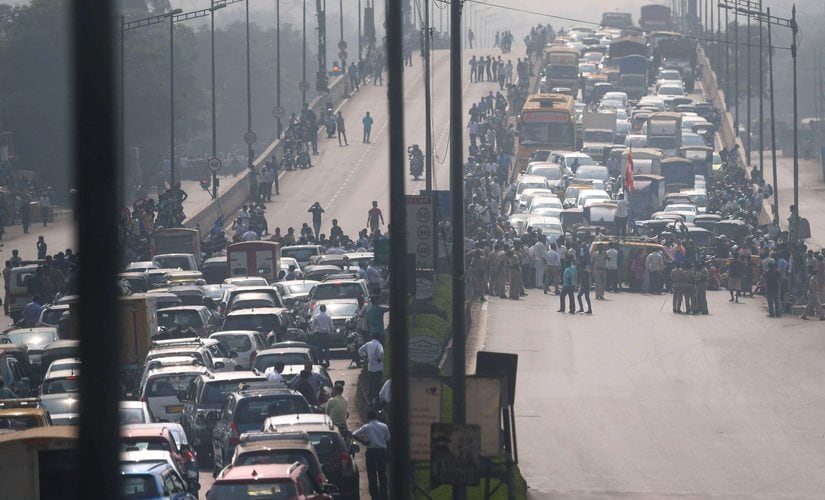 Dalit protesters block the traffic at Western Express Highway near Aarey Check Naka during a 'Rasta Roko' protest over Bhima Koregaon violence, in Mumbai on Wednesday. PTI