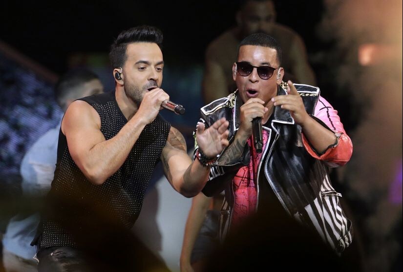 FILE - In this April 27, 2017, file photo, singers Luis Fonsi, left, and Daddy Yankee perform during the Latin Billboard Awards in Coral Gables, Fla. the artists are the leading nominees at the iHeartRadio Music Awards. IHeartMedia announced Wednesday, Jan. 10, that Fonsi and Yankee scored seven nominations each, including song of the year for the tune’s version with Justin Bieber. The fifth annual awards show will take place March 11 at the Forum in Inglewood, Calif. (AP Photo/Lynne Sladky, File)