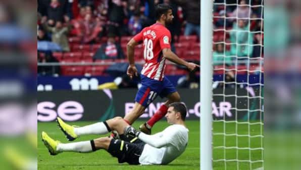 La Liga: Diego Costa sent off after scoring in Atletico Madrid's win over Getafe; Real Betis defeat Sevilla