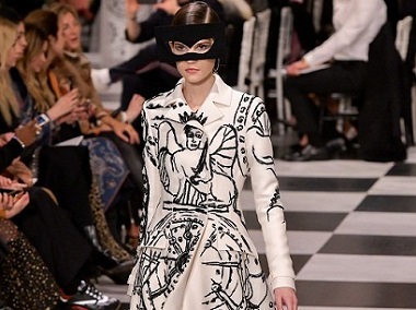Dior designer Maria Grazia Chiuri channels surrealism in predominantly black-and-white fashion show Dior designer Maria Grazia Chiuri channels surrealism in predominantly black-and-white fashion show