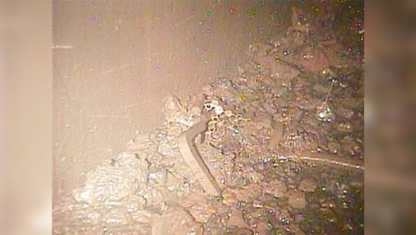 Fukushima operator TEPCO releases fresh images of reactor wreckage; broken parts, debris that could be melted fuel seen
