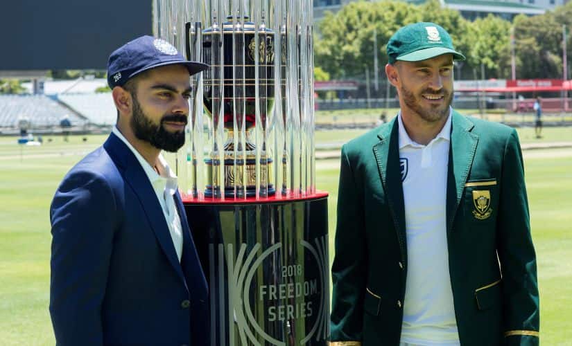 India’s captain Virat Kohli(L) and South Africa’s captain Faf du Plessis pose with the 2018 Freedom Series trophy. The first Test starts on 5 January. AFP