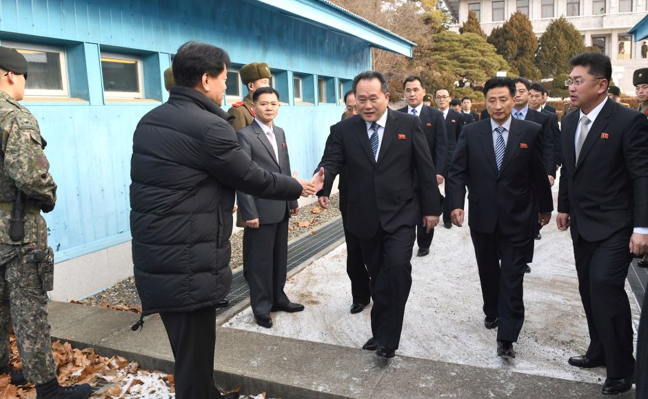 Head of North Korean delegation Ri Son Gwon, Chairman of the Committee for the Peaceful Reunification of the Country (CPRC) of DPRK, is greeted by a South Korean official as he crosses a concrete border to attend their meeting at the truce village of Panmunjom in the demilitarised zone separating the two Koreas. Reuters Head of North Korean delegation Ri Son Gwon, Chairman of the Committee for the Peaceful Reunification of the Country (CPRC) of DPRK, is greeted by a South Korean official as he crosses a concrete border to attend their meeting at the truce village of Panmunjom in the demilitarised zone separating the two Koreas. Reuters