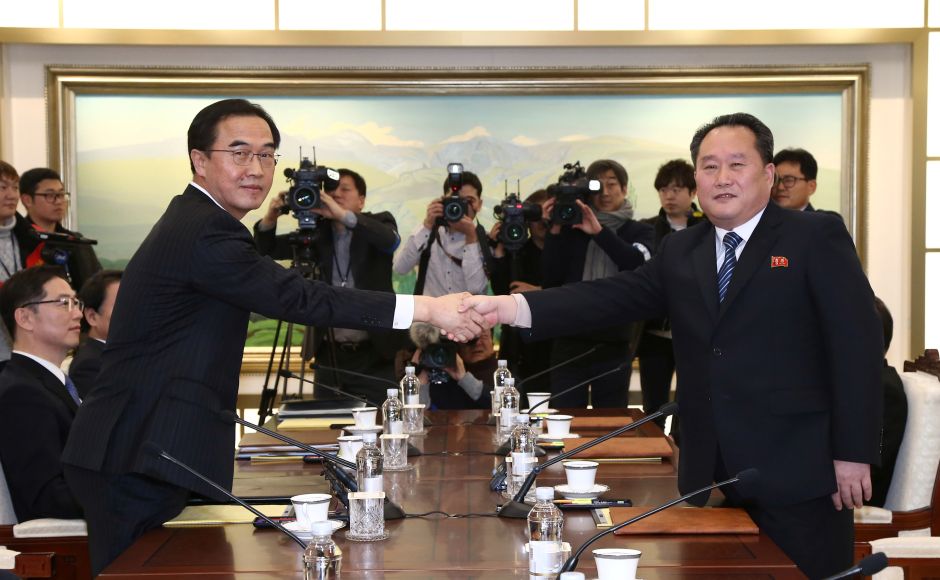 Ri Son Gwon shakes hands with his South Korean counterpart Cho Myoung-gyon during their meeting at the truce village of Panmunjom where North Korea announced it will send it will send a delegation of high-ranking officials, athletes and a cheering squad to the Pyeongchang Winter Olympics in South Korea next month. Reuters Ri Son Gwon shakes hands with his South Korean counterpart Cho Myoung-gyon during their meeting at the truce village of Panmunjom where North Korea announced it will send it will send a delegation of high-ranking officials, athletes and a cheering squad to the Pyeongchang Winter Olympics in South Korea next month. Reuters