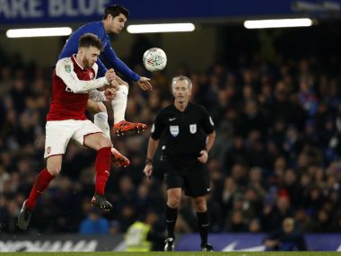 Arsenal's Calum Chambers (L) vies with Chelsea's Alvaro Morata during the League Cup semifinal first leg . AFP