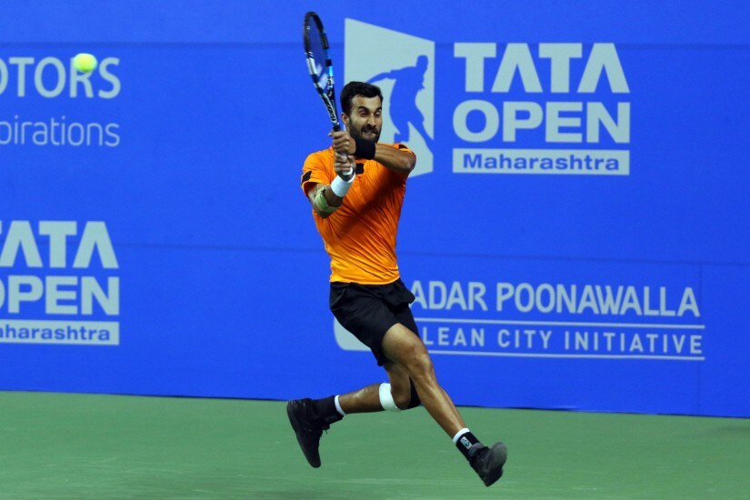 Yuki Bhambri returns a shot during a match at the Maharashtra Open.