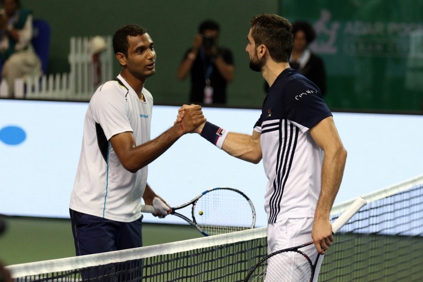 Top seed Marin Cilic with Ramkumar Ramanathan at the net after their second round match. Maharashtra Open