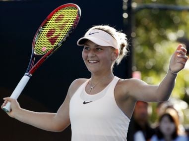 Marta Kostyuk celebrates her win over Peng Shuai during the first round. AP