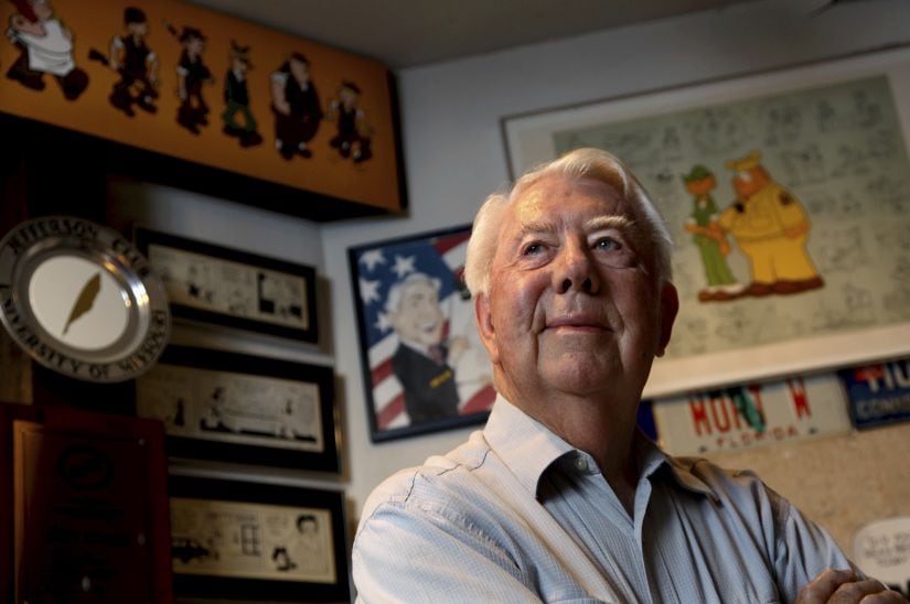 FILE - In this Aug. 16, 2010 file photo, Mort Walker, the artist and author of the Beetle Bailey comic strip, stands in his studio in Stamford, Conn. On Saturday, Jan. 27, 2018, a family member said the comic strip artist has died. He was 94. (AP Photo/Craig Ruttle)