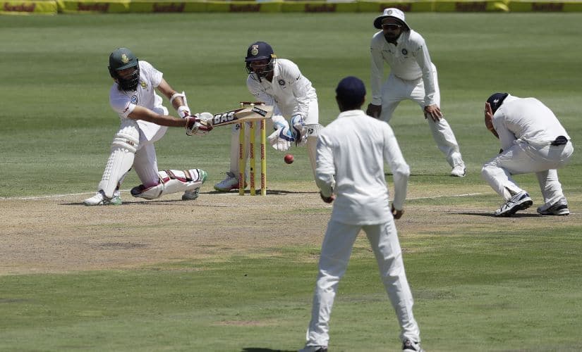 South Africa’s batsman Hashim Amla‚ far left, plays a side shot as India’s wicketkeeper Parthiv Patel, second from left, and teammates watches during the first day of the second cricket test match between South Africa and India at Centurion Park in Pretoria, South Africa, Saturday, Jan. 13, 2018. (AP Photo/Themba Hadebe)