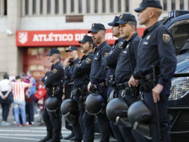 Police outside the stadium before the match. Reuters