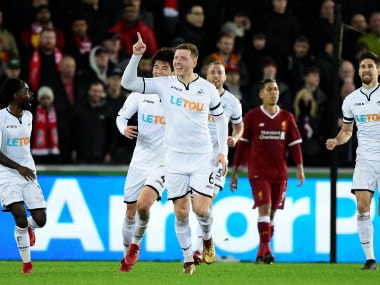 Swansea City's Alfie Mawson celebrates scoring their first goal. Reuters