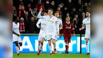 Premier League: Swansea City's Alfie Mawson helps end Liverpool's unbeaten run after Virgil van Dijk error