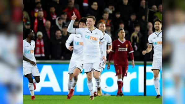 Premier League: Swansea City's Alfie Mawson helps end Liverpool's unbeaten run after Virgil van Dijk error